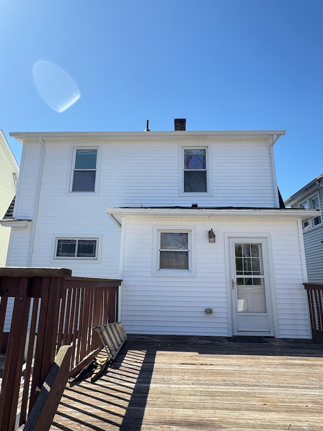 273 Peck Ave, West Haven, CT 06516 - rear view of house with a wooden deck and a chimney