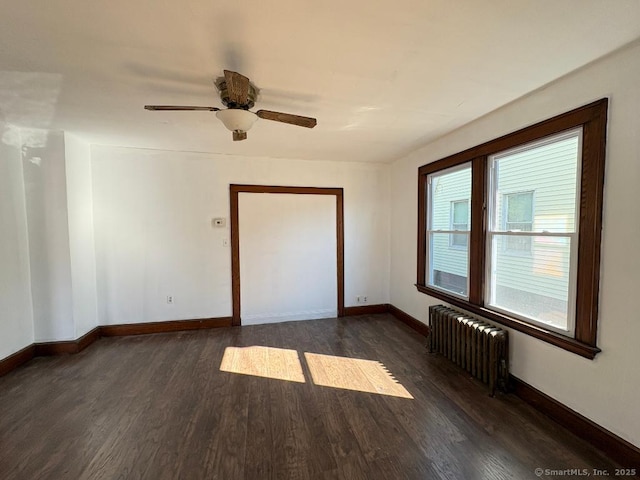 273 Peck Ave, West Haven, CT 06516 - spare room featuring radiator, dark wood-type flooring, baseboards, and ceiling fan