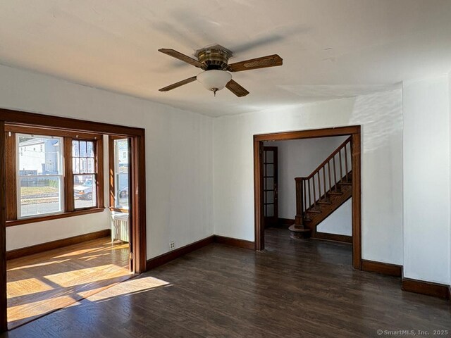 273 Peck Ave, West Haven, CT 06516 - spare room featuring wood finished floors, a ceiling fan, baseboards, and stairway