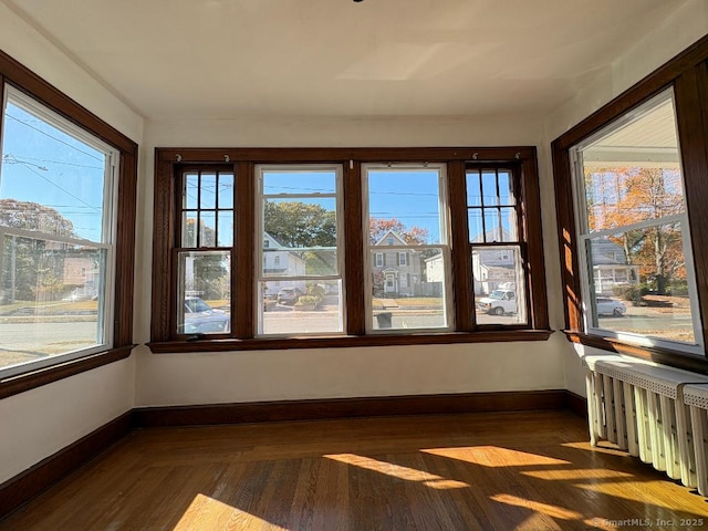 273 Peck Ave, West Haven, CT 06516 - unfurnished sunroom with radiator, plenty of natural light, and baseboards
