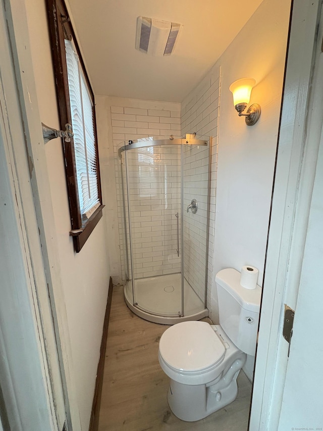 273 Peck Ave, West Haven, CT 06516 - bathroom with a stall shower, wood finished floors, and toilet