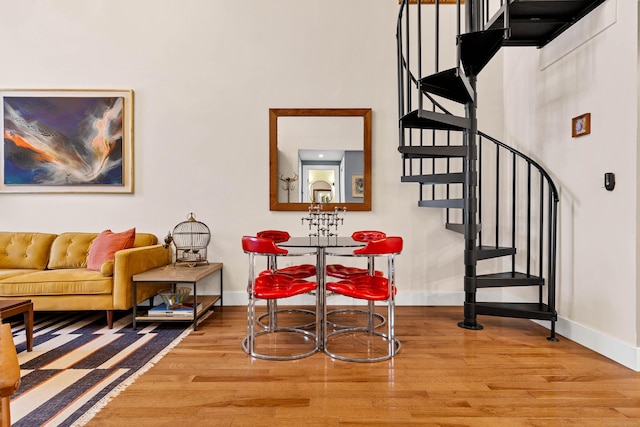 4 Coggswell St Unit 2, Stonington, CT 06379 - dining area featuring wood finished floors, baseboards, and stairs
