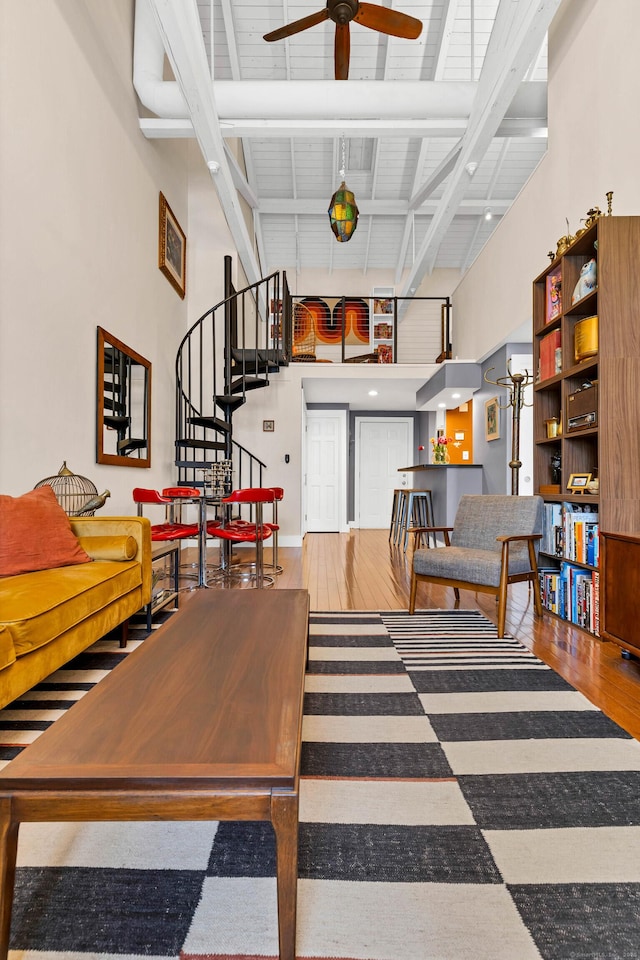 4 Coggswell St Unit 2, Stonington, CT 06379 - dining space with ceiling fan, stairs, wood finished floors, beamed ceiling, and a high ceiling