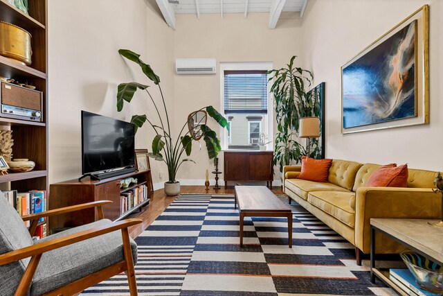 4 Coggswell St Unit 2, Stonington, CT 06379 - living room featuring a wall mounted air conditioner, wood finished floors, and beam ceiling
