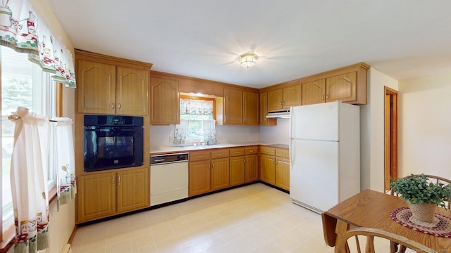 14 Winding Ln, Enfield, CT 06082 - kitchen with white appliances, light countertops, light flooring, and a sink