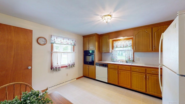 14 Winding Ln, Enfield, CT 06082 - kitchen with white appliances, a baseboard radiator, and brown cabinets