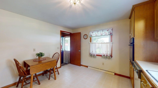 14 Winding Ln, Enfield, CT 06082 - dining area featuring a baseboard radiator, baseboards, and light floors