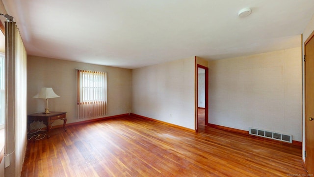 14 Winding Ln, Enfield, CT 06082 - empty room with light wood finished floors, a smoke detector, and baseboards