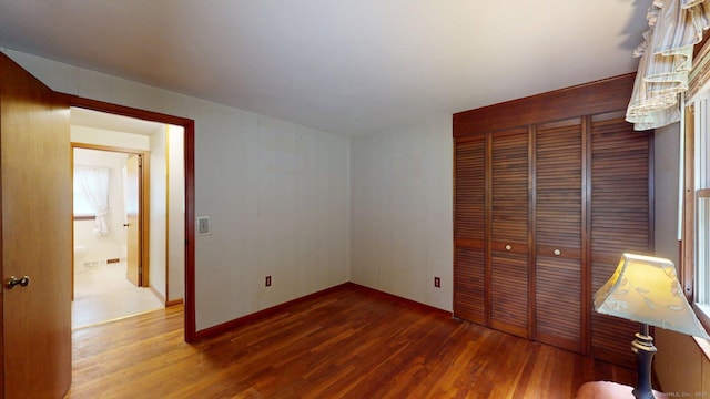 14 Winding Ln, Enfield, CT 06082 - unfurnished bedroom with wood finished floors and a closet