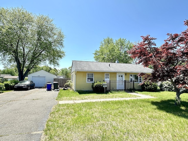 view of front of house with a garage and asphalt driveway