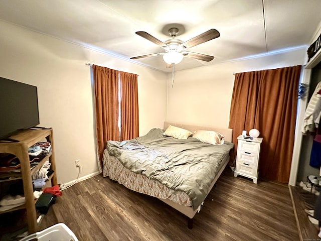 bedroom featuring wood finished floors and a ceiling fan