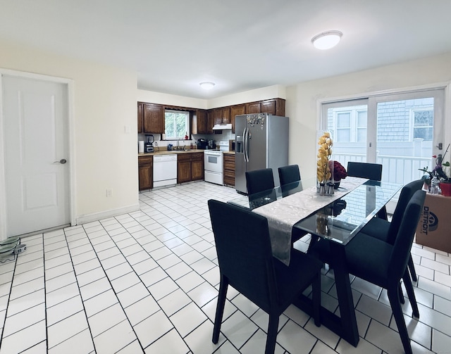 22 Palmer Ave, Stamford, CT 06902 - dining area with baseboards and light tile patterned floors
