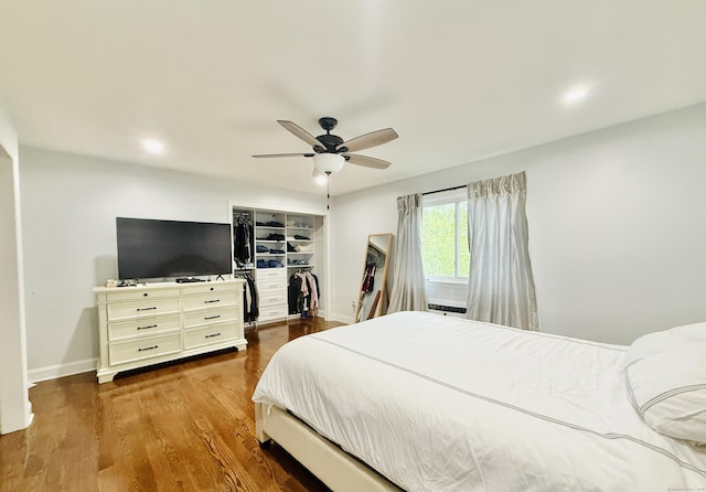 22 Palmer Ave, Stamford, CT 06902 - bedroom with baseboards, ceiling fan, wood finished floors, a walk in closet, and a closet