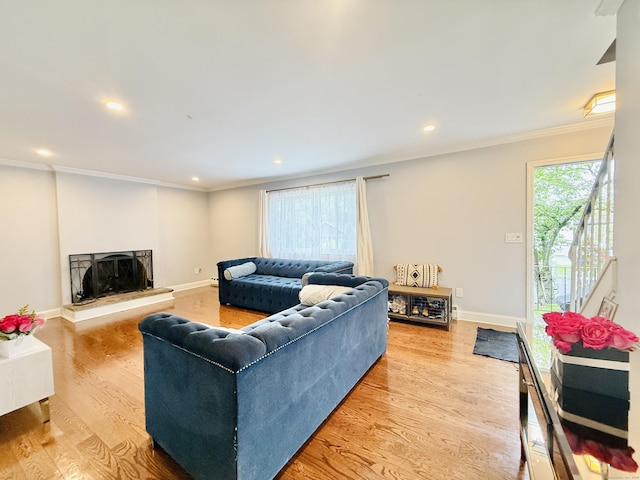 22 Palmer Ave, Stamford, CT 06902 - living area with ornamental molding, wood finished floors, baseboards, recessed lighting, and a fireplace with raised hearth