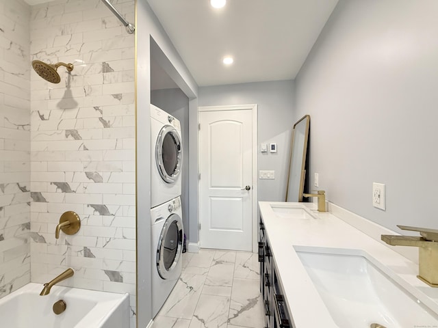 22 Palmer Ave, Stamford, CT 06902 - bathroom with stacked washer / dryer, marble look tiles, double vanity, bathing tub / shower combination, and recessed lighting