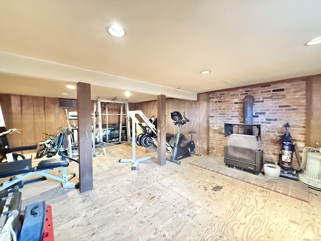 22 Palmer Ave, Stamford, CT 06902 - workout area with a wood stove, wood walls, and recessed lighting