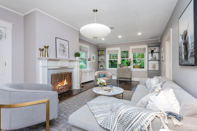 living area featuring wood finished floors, ornamental molding, recessed lighting, a high end fireplace, and radiator