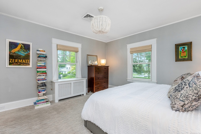 carpeted bedroom with radiator heating unit, a chandelier, crown molding, and baseboards
