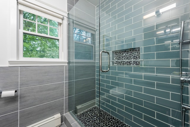bathroom featuring a baseboard radiator and a stall shower
