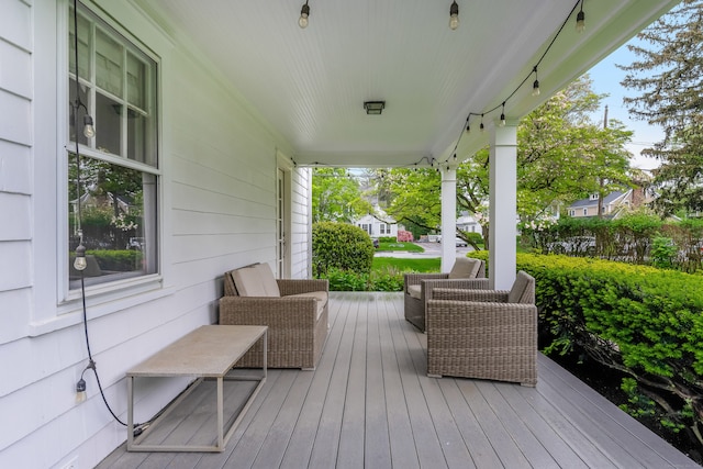 wooden deck featuring covered porch
