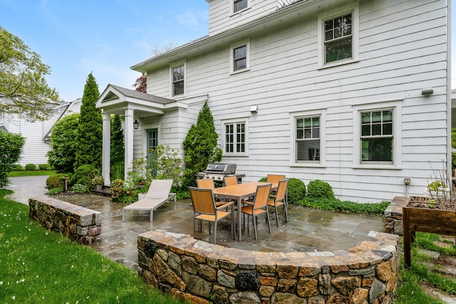 back of house with a patio