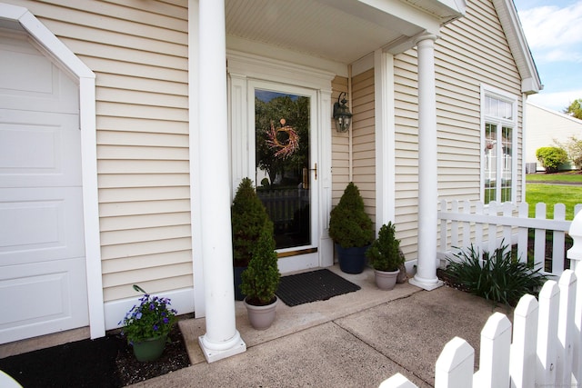 view of exterior entry featuring a porch