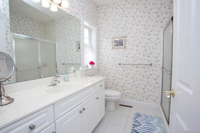 bathroom featuring wallpapered walls, tile patterned flooring, a shower stall, vanity, and baseboards