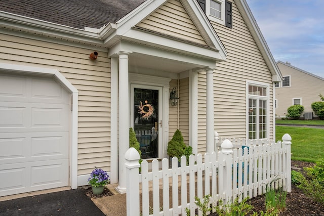 2 Plum Tree Cir, Farmington, CT 06032 - doorway to property featuring fence, roof with shingles, and central AC