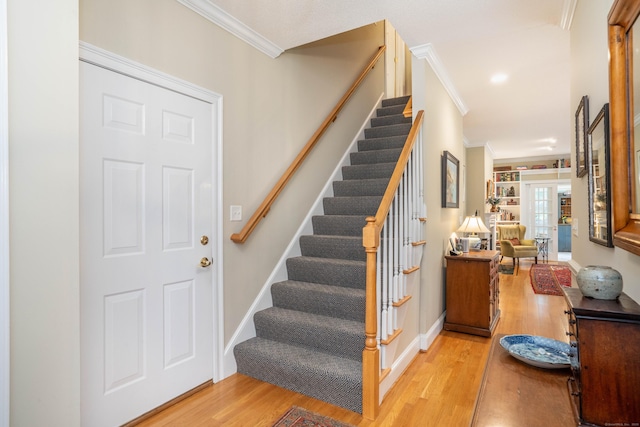 2 Plum Tree Cir, Farmington, CT 06032 - stairway featuring crown molding, wood finished floors, and baseboards
