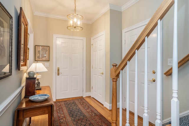 2 Plum Tree Cir, Farmington, CT 06032 - foyer entrance featuring stairs, crown molding, light wood-style floors, and a chandelier