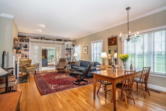 2 Plum Tree Cir, Farmington, CT 06032 - dining area featuring wood finished floors, a chandelier, crown molding, and baseboards
