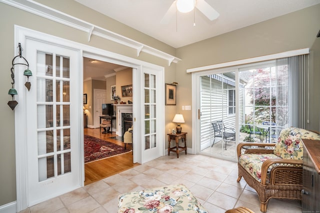 2 Plum Tree Cir, Farmington, CT 06032 - sitting room with french doors, light tile patterned floors, ceiling fan, and crown molding