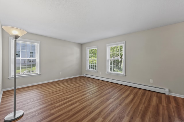 5 Nutmeg Ln, East Hampton, CT 06424 - unfurnished room with a baseboard radiator, wood finished floors, and baseboards