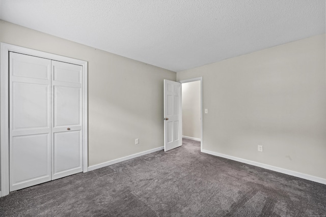 5 Nutmeg Ln, East Hampton, CT 06424 - unfurnished bedroom featuring carpet, baseboards, a textured ceiling, and a closet