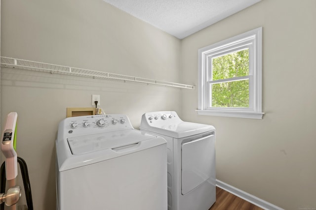 5 Nutmeg Ln, East Hampton, CT 06424 - laundry room featuring independent washer and dryer, baseboards, wood finished floors, and a textured ceiling