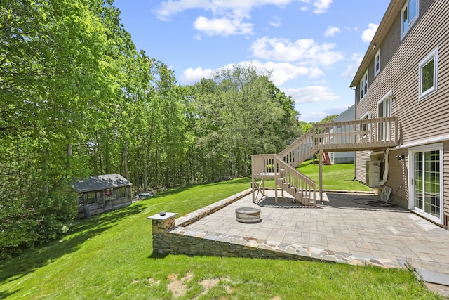 5 Nutmeg Ln, East Hampton, CT 06424 - view of grassy yard featuring stairway, a patio, a deck, and an outbuilding
