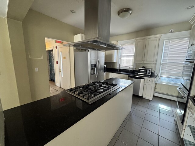 485 Laurel Ave, Bridgeport, CT 06605 - kitchen with island exhaust hood, appliances with stainless steel finishes, a sink, and white cabinets