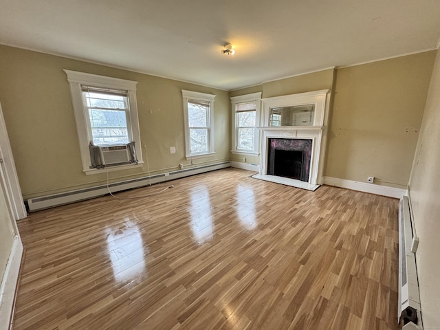 485 Laurel Ave, Bridgeport, CT 06605 - unfurnished living room with a baseboard heating unit, wood finished floors, baseboard heating, and baseboards