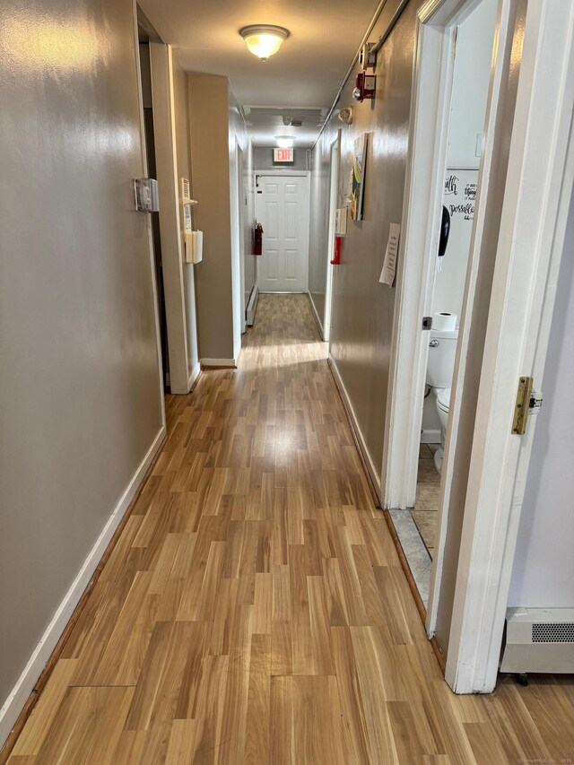 485 Laurel Ave, Bridgeport, CT 06605 - hallway with light wood-style floors, baseboards, and a baseboard radiator