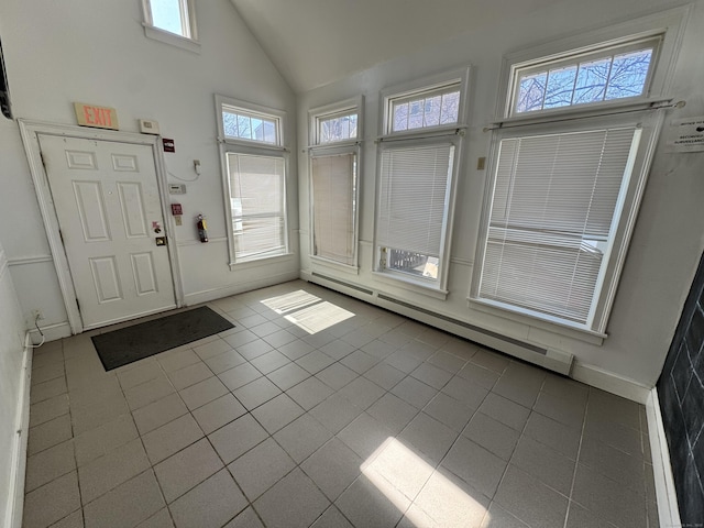 485 Laurel Ave, Bridgeport, CT 06605 - tiled entryway with a baseboard heating unit, baseboards, and high vaulted ceiling