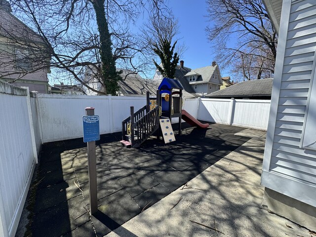 485 Laurel Ave, Bridgeport, CT 06605 - deck featuring a playground and a fenced backyard