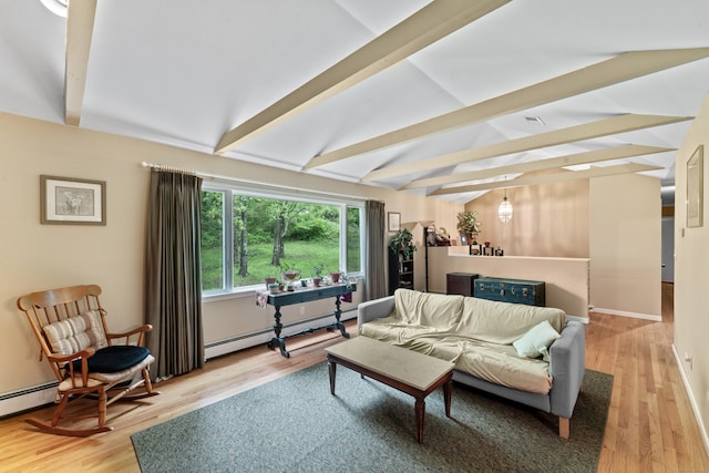 living room with a baseboard heating unit, light wood-style floors, and baseboards