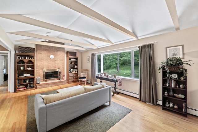 living room with light wood-style flooring, a brick fireplace, a baseboard radiator, and baseboard heating
