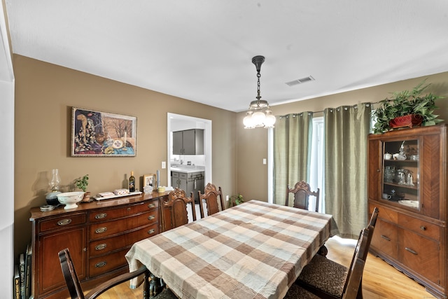 dining room featuring light wood-style flooring