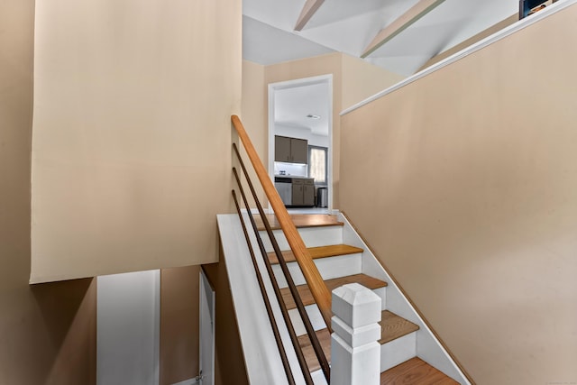 stairway featuring wood finished floors