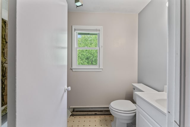 bathroom with vanity, toilet, and tile patterned floors