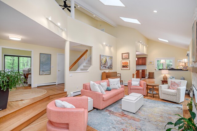 22 Kristy Dr, Bethel, CT 06801 - living room featuring a baseboard heating unit, wood finished floors, stairs, a skylight, and recessed lighting