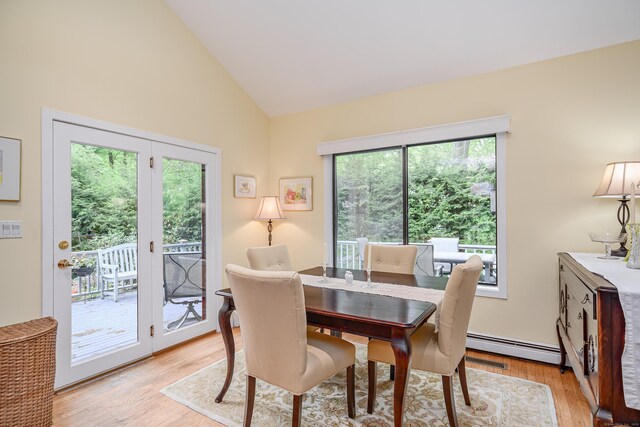 22 Kristy Dr, Bethel, CT 06801 - dining room with baseboard heating, light wood-style flooring, and high vaulted ceiling