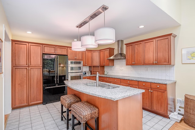 22 Kristy Dr, Bethel, CT 06801 - kitchen featuring black appliances, wall chimney range hood, backsplash, a kitchen bar, and brown cabinets