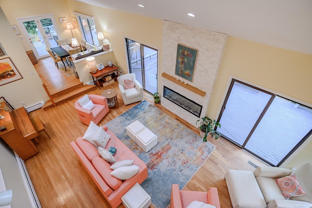 22 Kristy Dr, Bethel, CT 06801 - living area with a baseboard radiator, wood finished floors, a fireplace, and recessed lighting